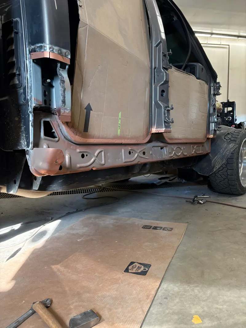 Vehicle body opened up for structural panel repair