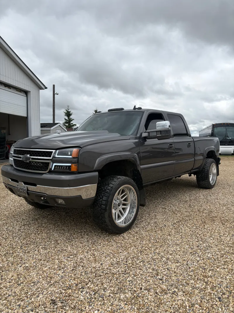 Grey Chevrolet pickup with a fresh finish outside the shop